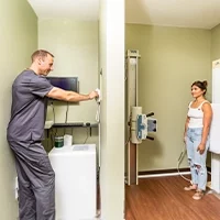 Chiropractor Westchase FL Andrew Danks With Patient In X-Ray Room